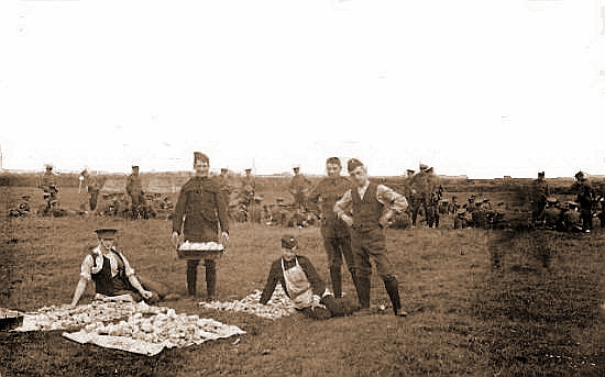 Photograph taken at the army camp at Squires Gate in 1907; Soldiers preparing potatoes.