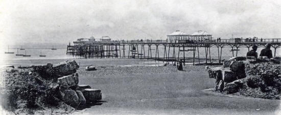 Two shops under construction half-way along the deck, 1898.
