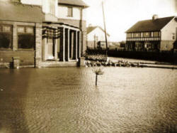 The flooded garden of a house on the corner of Clifton Drive and Highbury Road (now a nursing home).