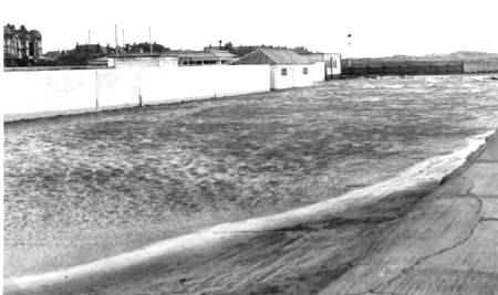 Car park at Open Air Baths, St.Annes, flooded by a high tide, December 1951.