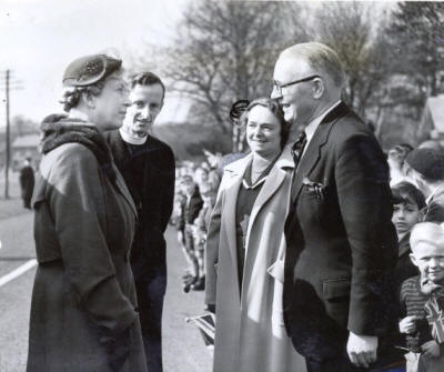 Princess Margaret speaking with the vicar, Rev Walsh, Mrs Lyon and the headmaster, Mr.Lyon.