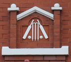 Cricket bats, balls and wickets in terra cotta which were probably placed within the pediment above the doorway to Alderlea. This feature was removed and is now at Rose Lea, in Woodland Grove. Cricket bats, balls and wickets in terra cotta which were probably placed within the pediment above the doorway to Alderlea. This feature was removed and is now at the house in Woodland Grove.