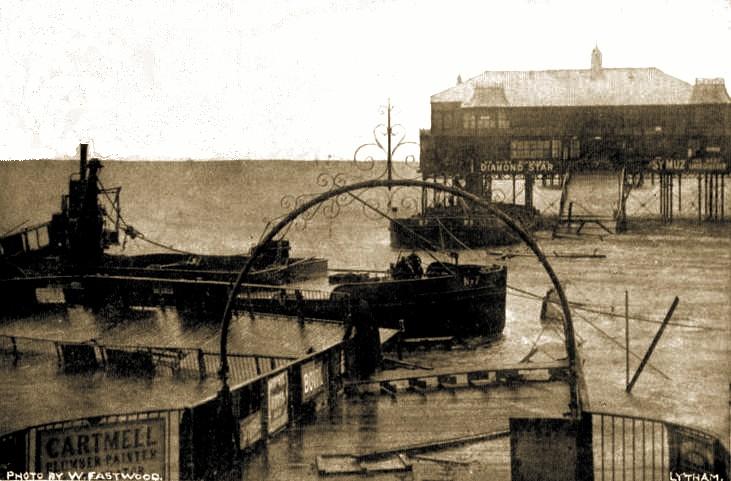 Lytham Pier cut through by barges during a storm in 1903.