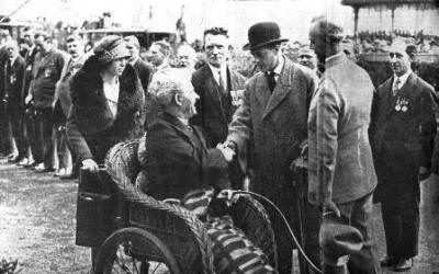 The Prince greeting Sergeant-Major J.R.Howarth, who was disabled during the 1914-18 War. Accompanying the Prince were Sergt-Major Jones (left) and Senior Commissioned Engineer E.E.Woods (right).