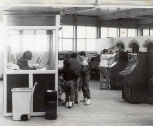 'Wilf' in his change kiosk, the Amusement Arcade, St.Annes Pier, in the early 1980s. 'Wilf' in his change kiosk, the Amusement Arcade, St.Annes Pier, in the early 1980s.