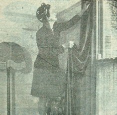 A boarding house in Warley Road, Blackpool, mid-March 1947. Mrs.A.Coleclough hangs her curtains again after a thorough clean, in readiness for Easter visitors.